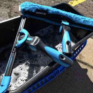 What do professional window cleaners use on hard water stains?