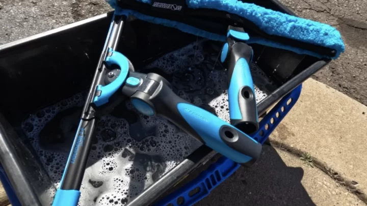 What do professional window cleaners use on hard water stains?